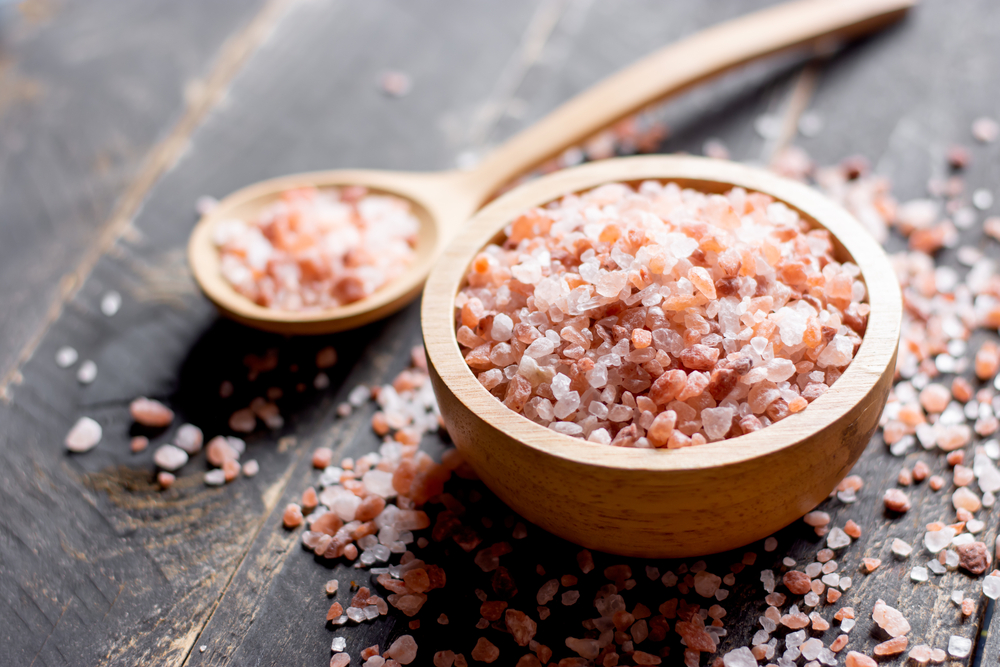 Pink salt crystals in a bowl